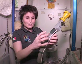 Astronaut Samantha Cristoforetti demonstrates how Astronauts use Toilet 