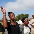 Worshipers hold Sunday service in parking lot Worshipers hold Sunday service in parking lot